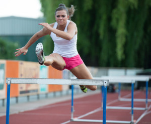 Professional female hurdler during training